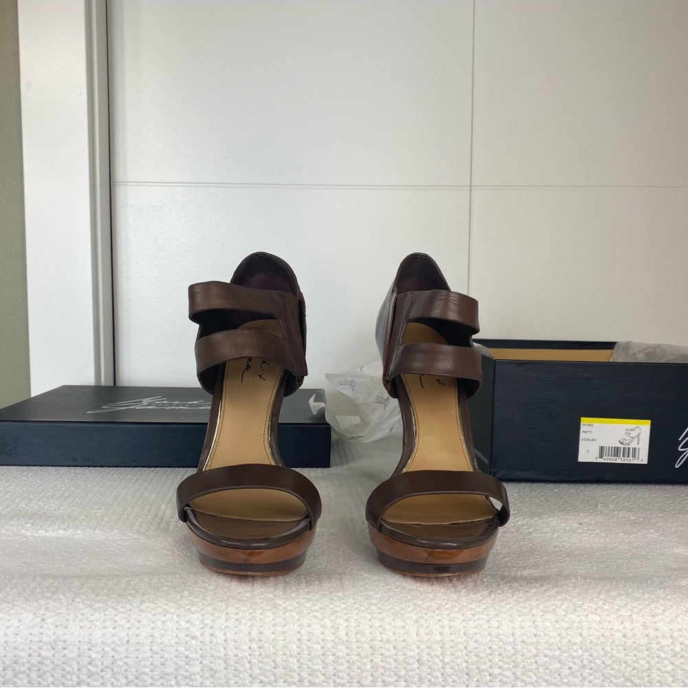 Heeled sandals with wood inlay, mark and James which is a badgely Mischka brand